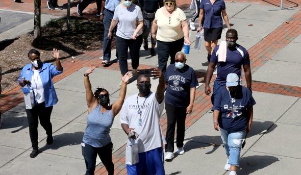 ODU employees start their Monarch Wellness Walk in front of Webb University Center.